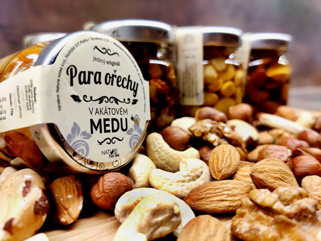 Various types of nuts in honey jars. Honey is a sweet, viscous food  substance made by honey bees and some related insects Stock Photo - Alamy